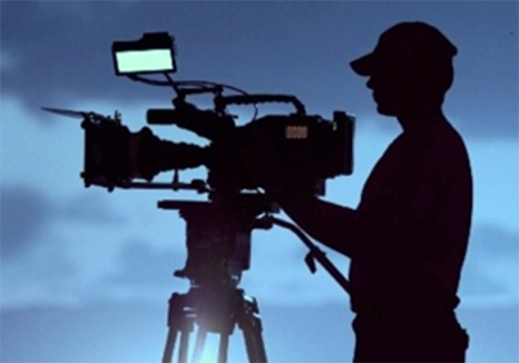 PHOTO: Silhouette of video camera and operator